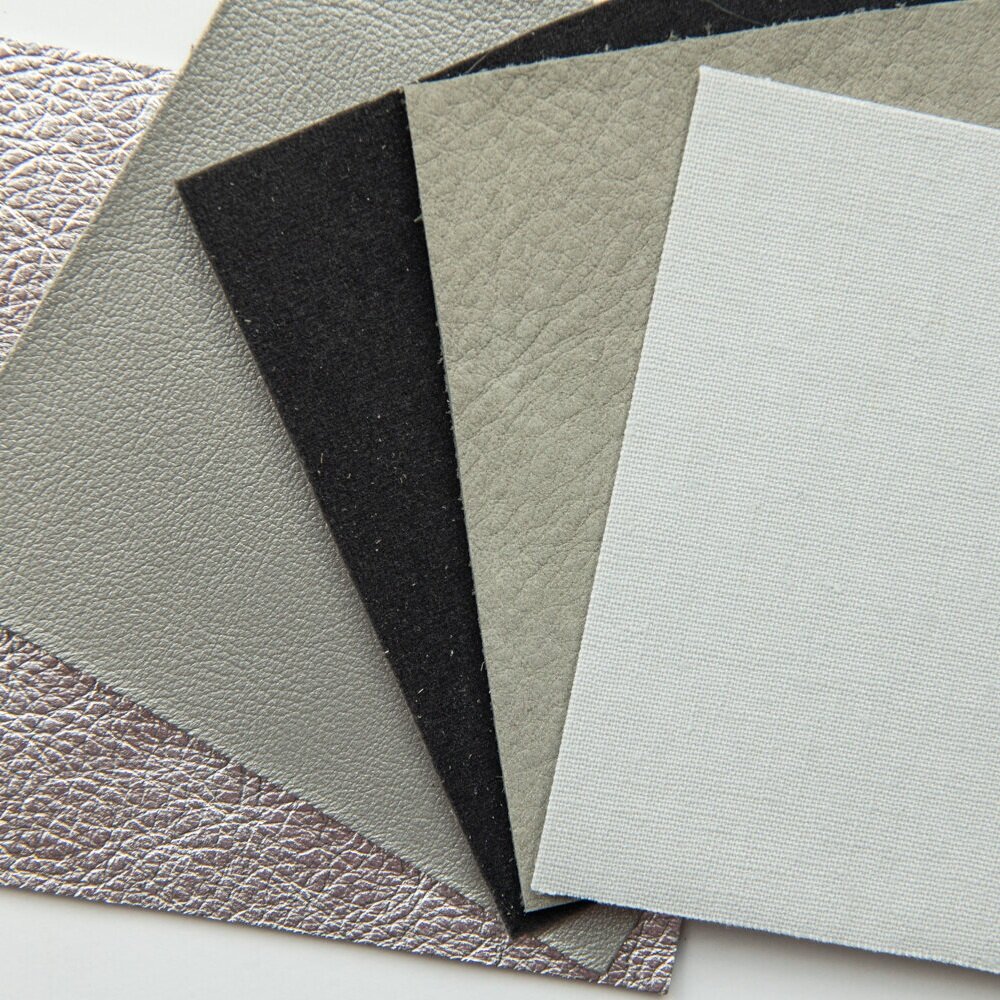 THERE ARE SO MANY COVER OPTIONS FOR YOUR ALBUM. YOU CAN CHOOSE FROM METALLIC, PEARL LEATHER, VELVET, SUEDE, AND LINEN. HERE IS A SAMPLE OF GRAYS IN THE DIFFERENT TEXTURES.